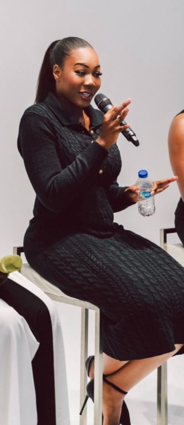 Meredith Shola speaking on stage